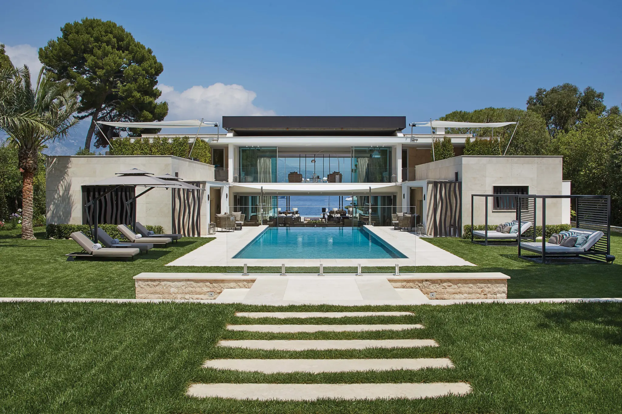 Contemporary coastal villa with a central swimming pool
